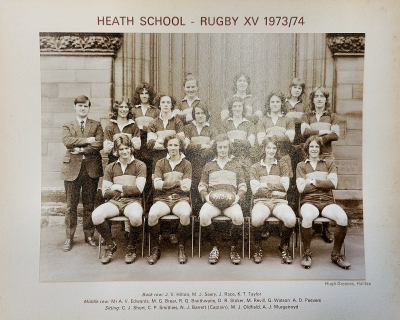 Formal photograph showing four players standing behind six players with Mr A.V. Edwards on their left standing behind five seated players