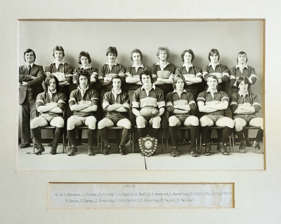 Formal photograph showing eight players with Mr A.V. Edwards on their left standing behind seven seated players