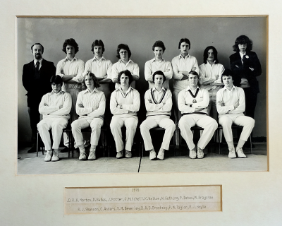 Formal photograph showing seven players with Mr Morton on their left standing behind six seated players