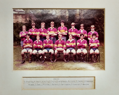 Formal photograph showing eight players standing behind seven seated players