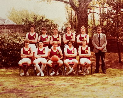 Formal photograph showing five players with Mr Stansfield on their right standing behind five seated players