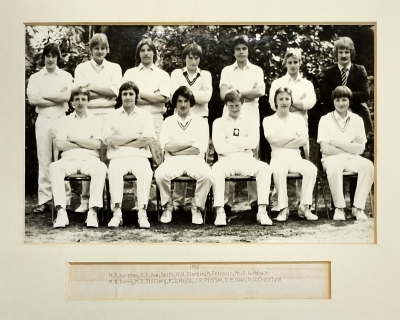 Formal photograph showing six players with Mr Hobson on their right standing behind six seated players